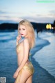 Atittaya Chaiyasing beauty poses hot on the beach with a yellow bikini (41 photos) P8 No.e52440
